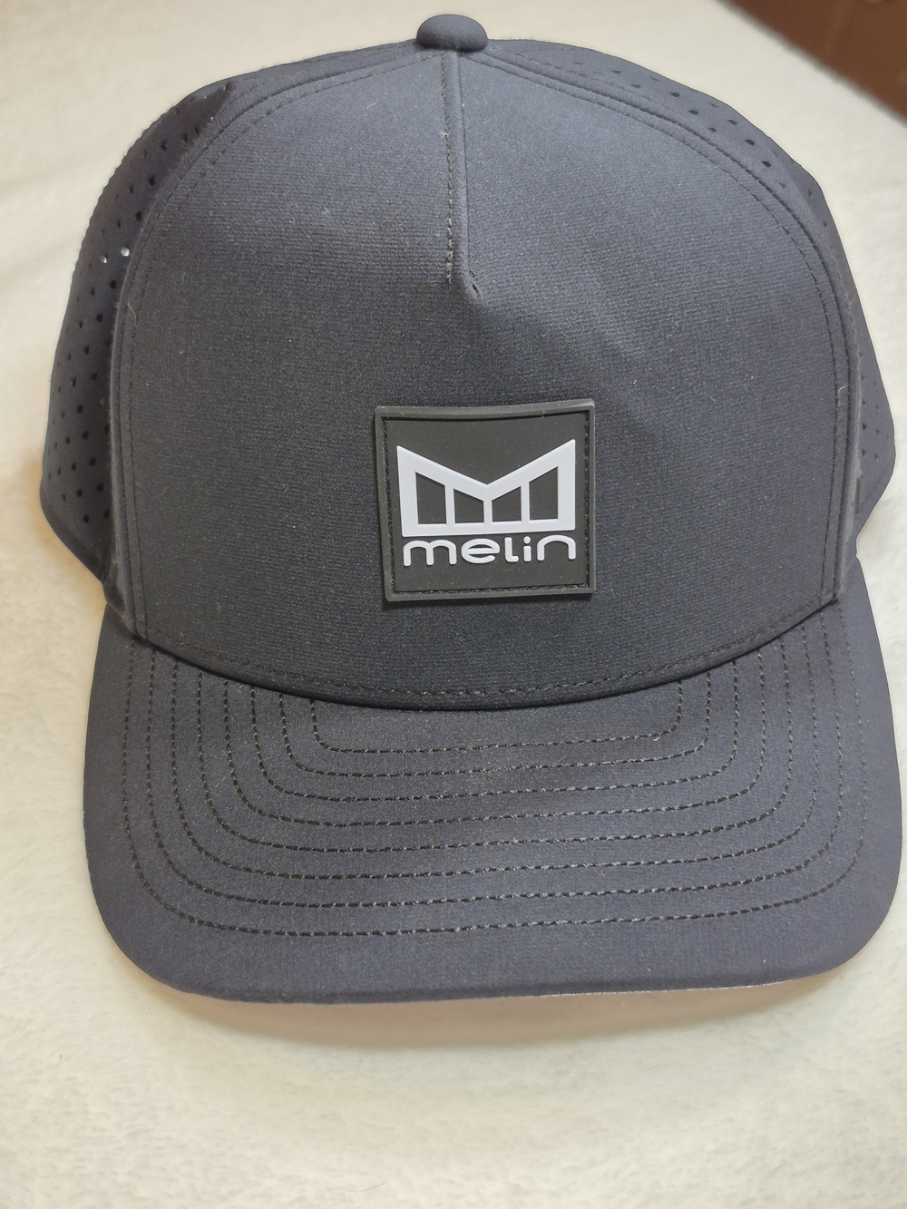 Melin Men's Black Performance Logo Cap Hydrophobic